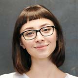 Woman with Glasses Smiling 1